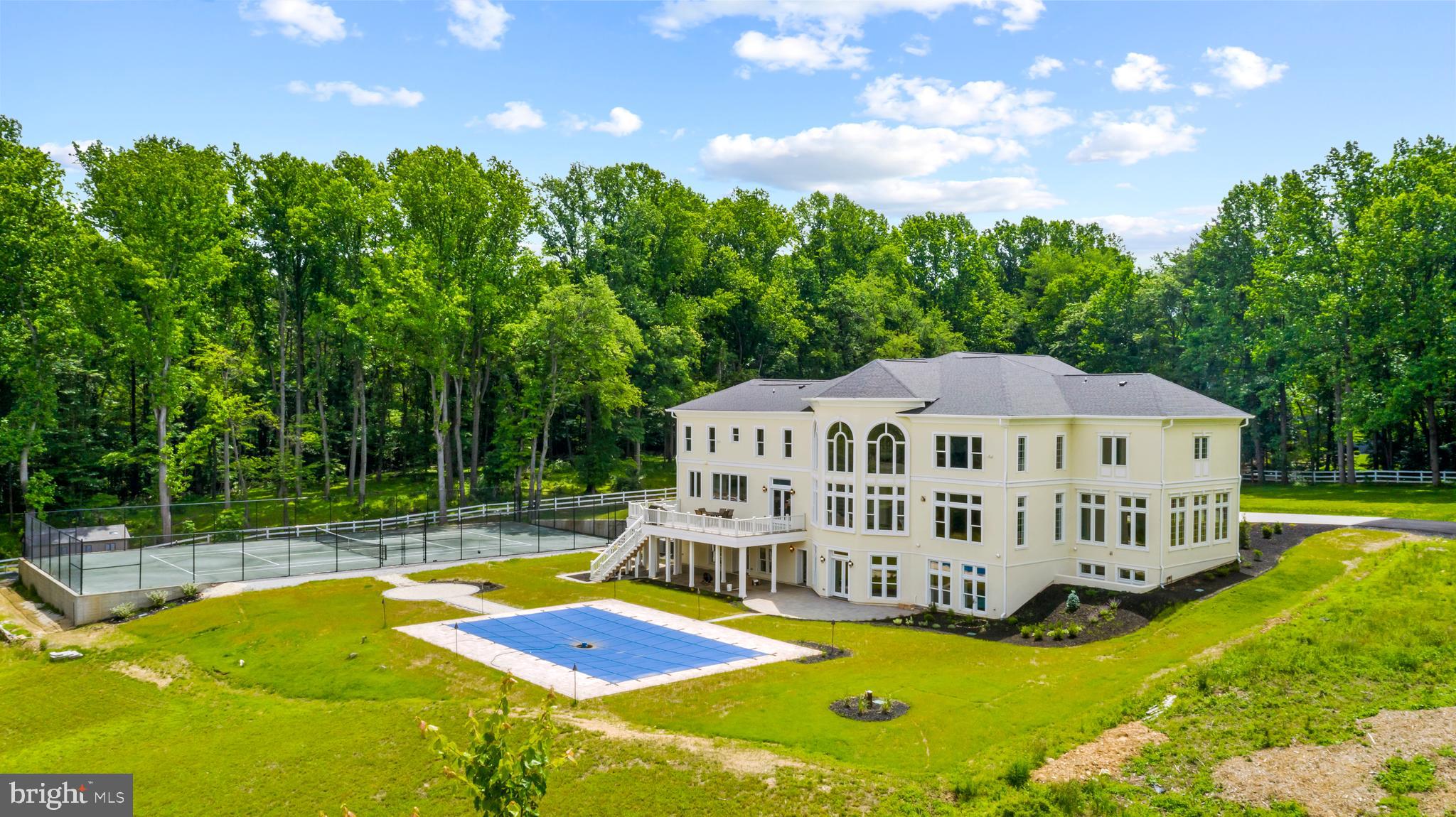 10305 Beach Mill Road Great Falls, VA 22066 - Photo 66 of 74 a view of a house with swimming pool and sitting area