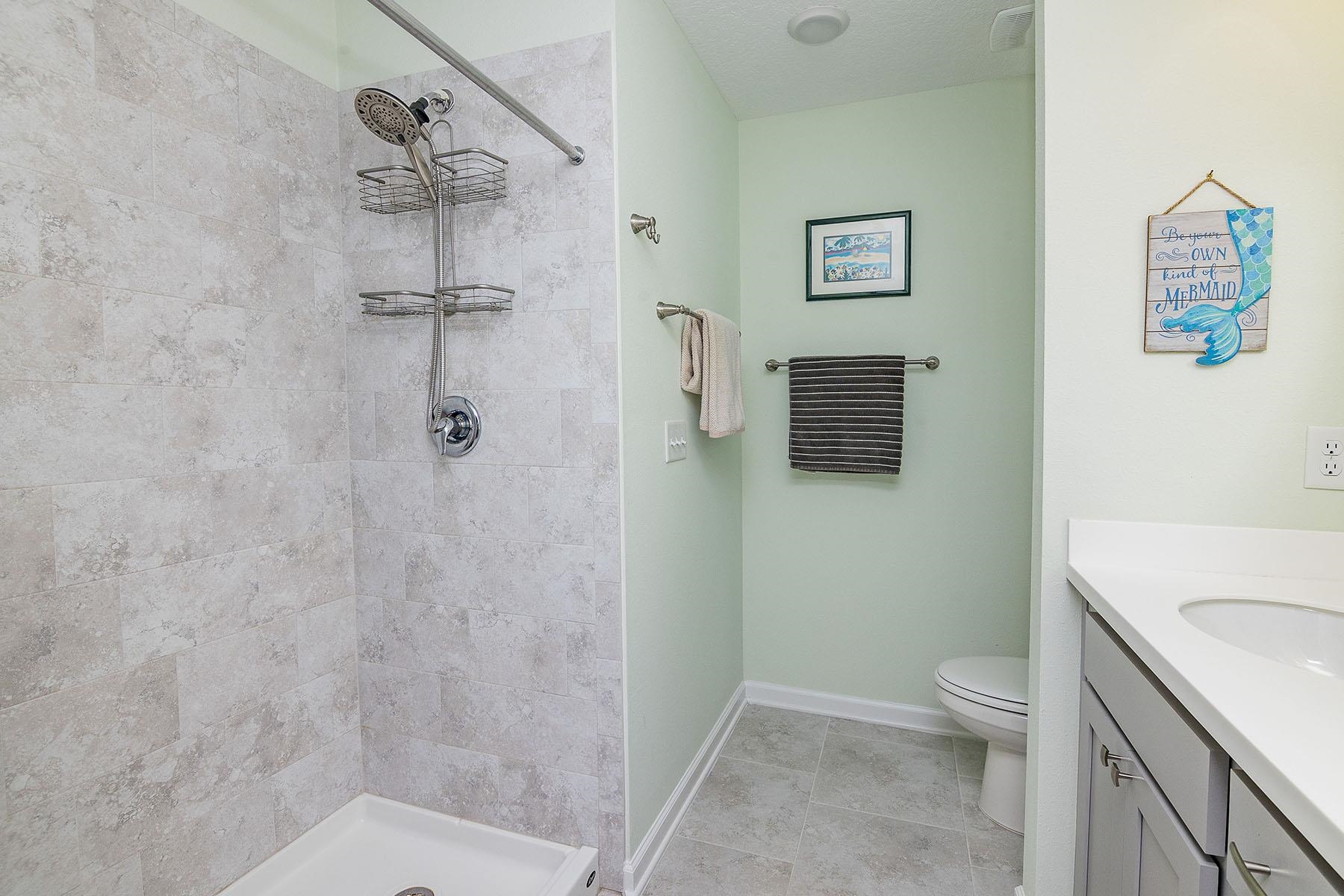 74 Ridge Lake Road St. Augustine, FL 32086 - Photo 29 of 47 Tiled step in shower