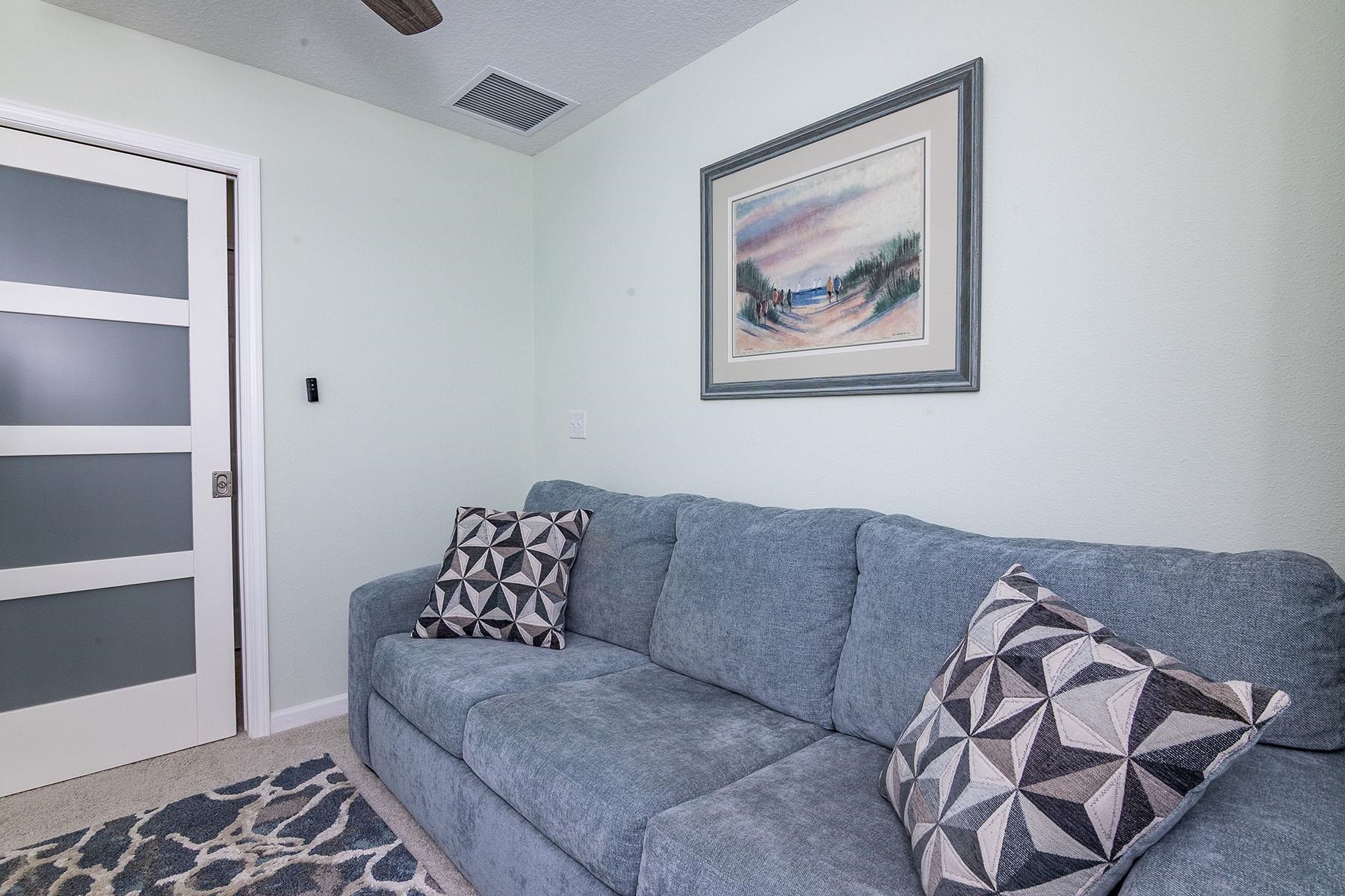 74 Ridge Lake Road St. Augustine, FL 32086 - Photo 30 of 47 Bedroom, office or exercise area with window and closet and sliding glass wood door