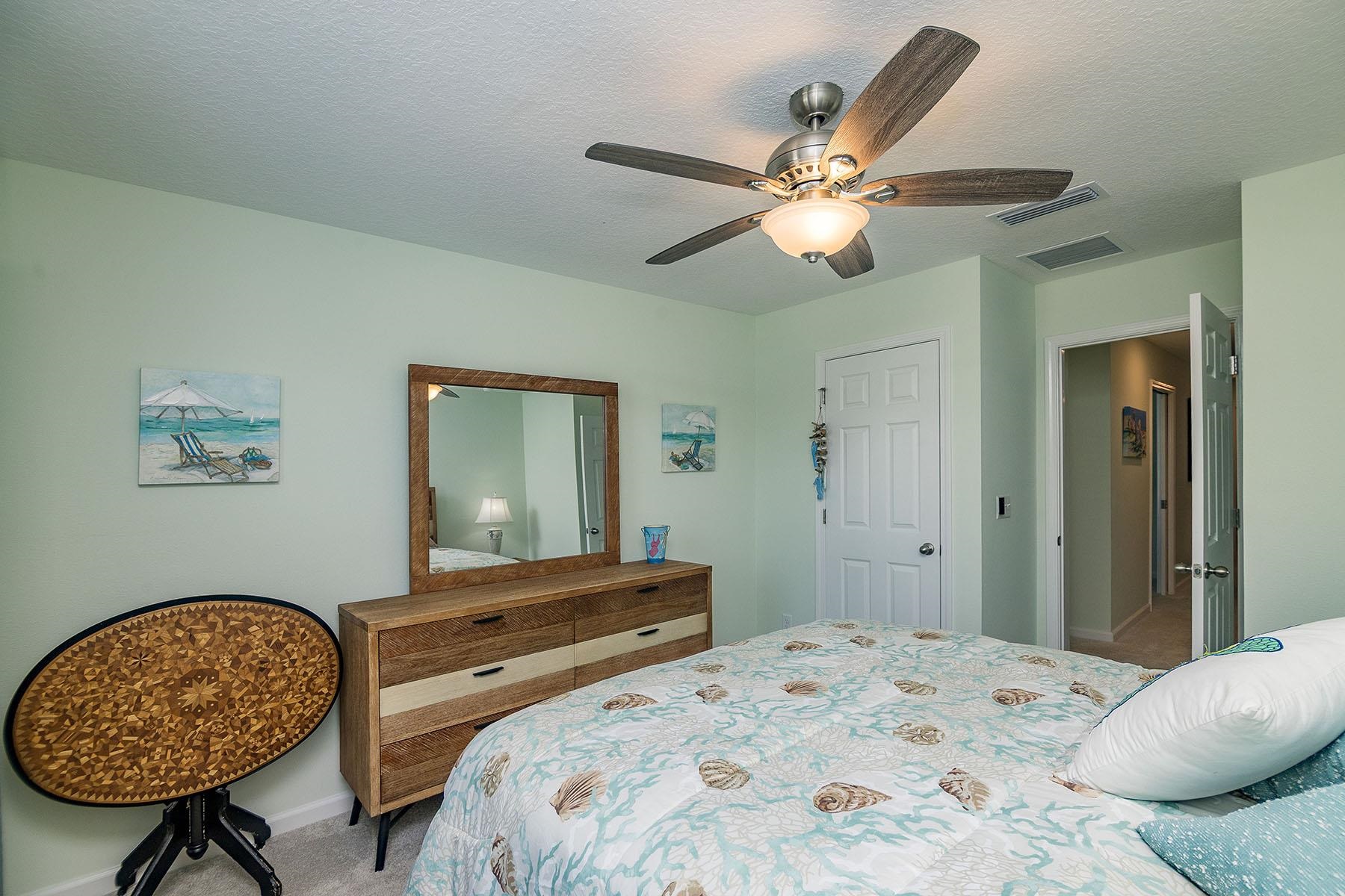 74 Ridge Lake Road St. Augustine, FL 32086 - Photo 34 of 47 Bedroom featuring a textured ceiling, carpet flooring, and ceiling fan
