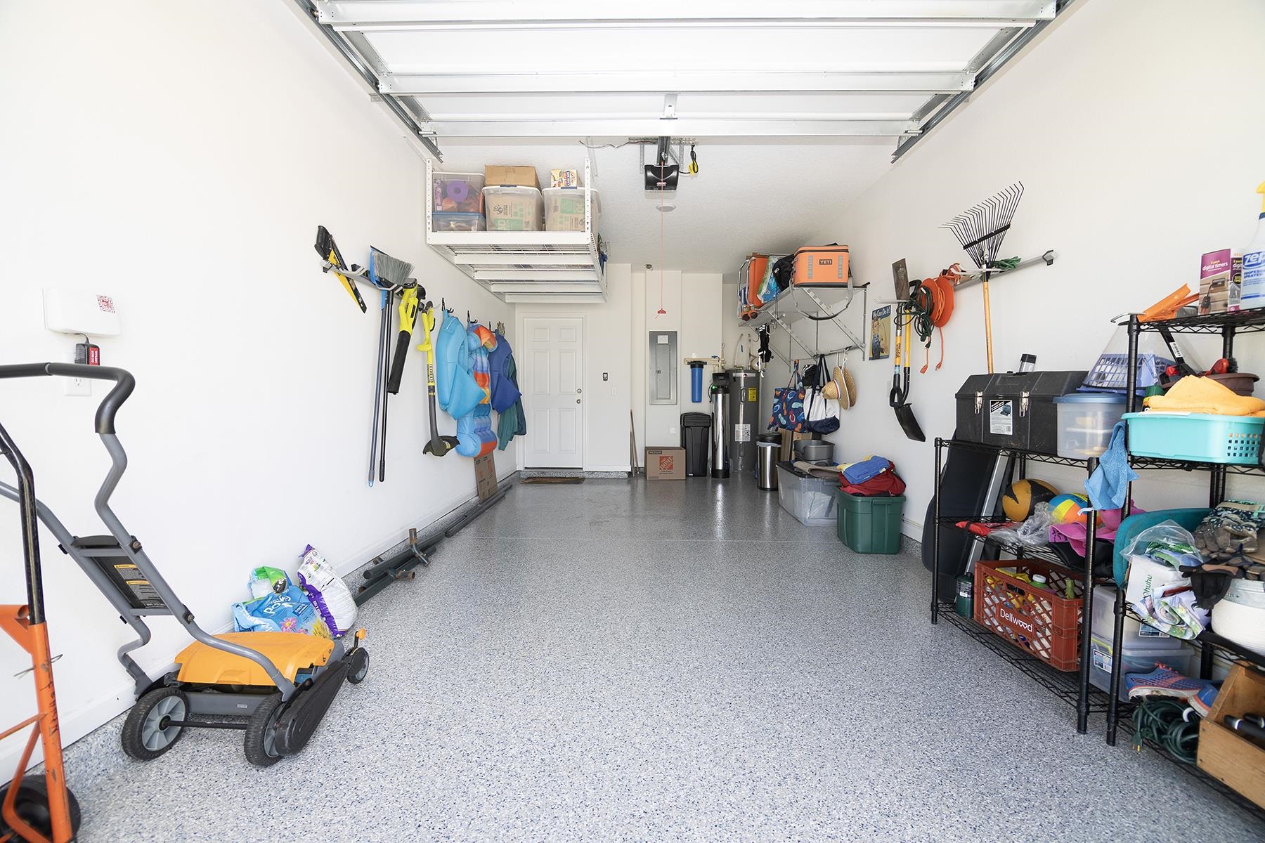 74 Ridge Lake Road St. Augustine, FL 32086 - Photo 36 of 47 Garage with epoxy floors, water softener, overhead storage