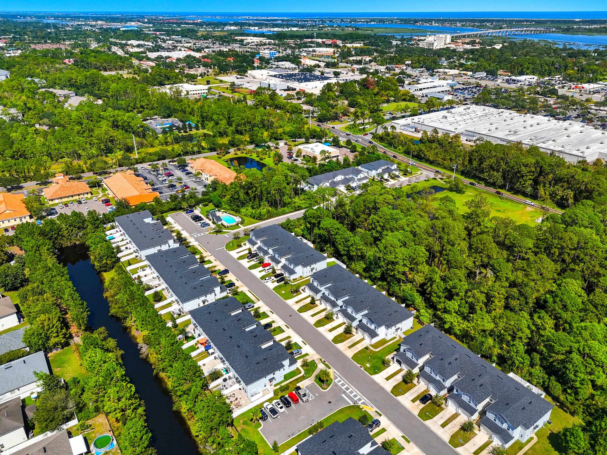 74 Ridge Lake Road St. Augustine, FL 32086 - Photo 44 of 47 Drone / aerial view of a large body of water and a tree filled landscape