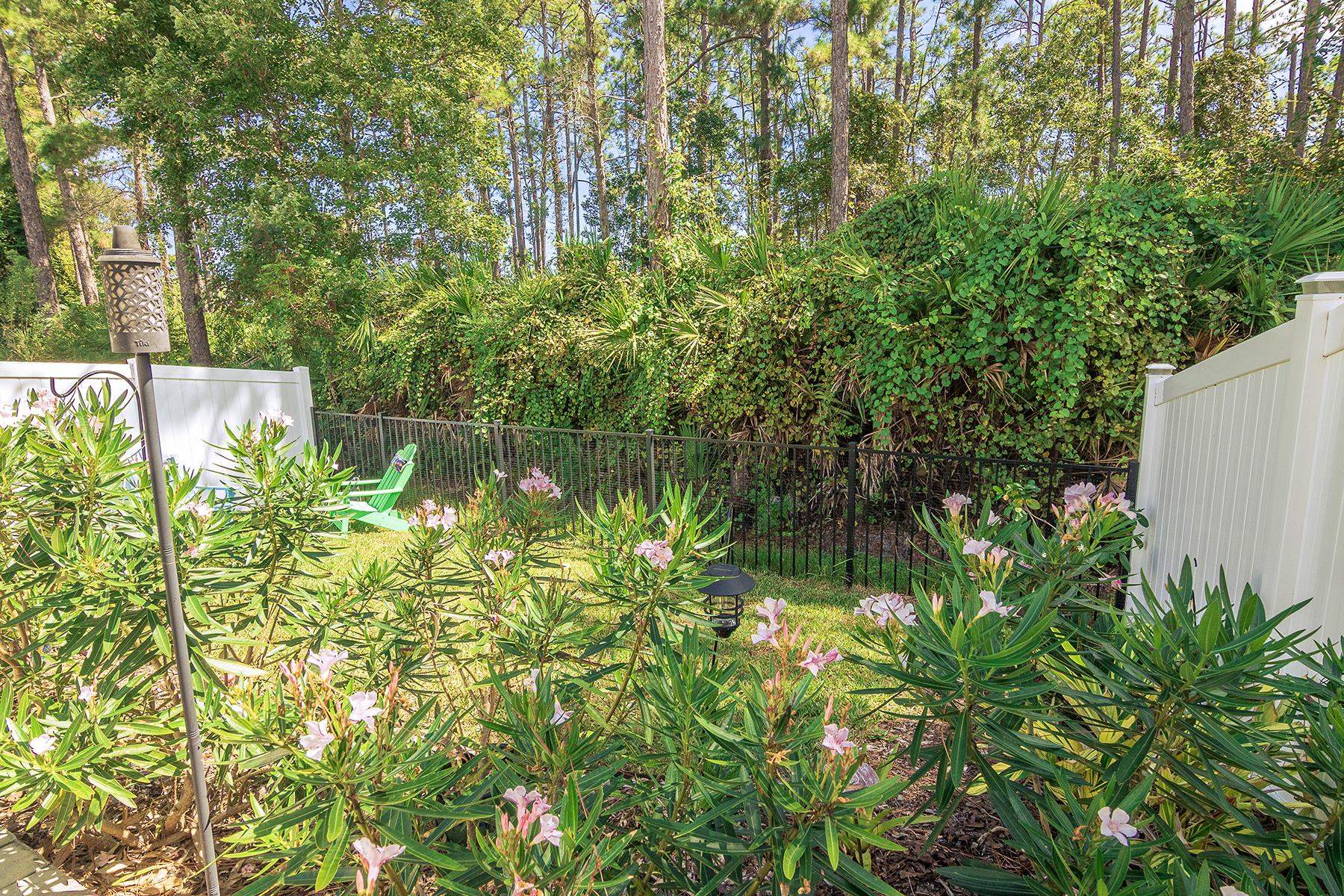 74 Ridge Lake Road St. Augustine, FL 32086 - Photo 8 of 47 View of yard with lush landscaping and preserve