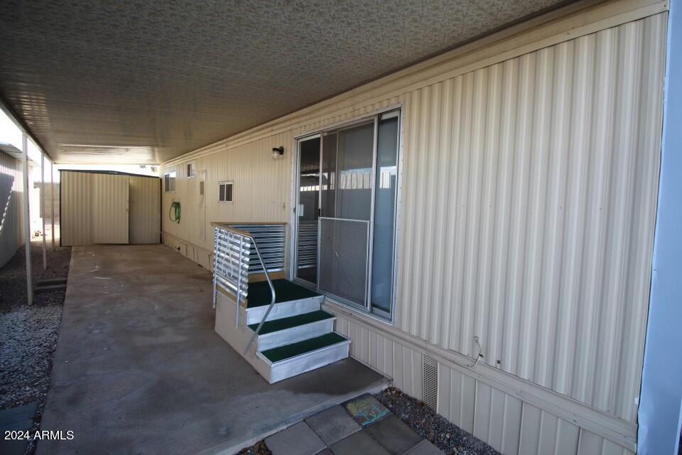 15802 South Gilbert Road, Unit 48 Chandler, AZ 85225 - Photo 12 of 17 east entrance stairs carport