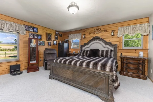 a bedroom with furniture and a window