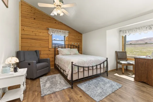 a bed room with a bed and a window