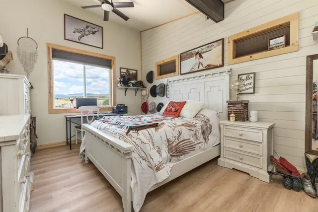 a bed room with a bed and a window