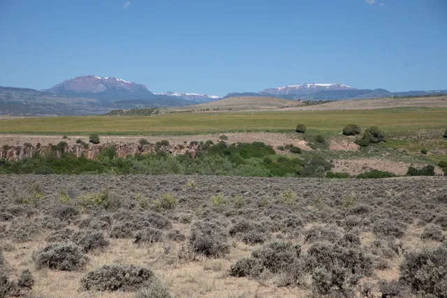 a view of lake with mountain in background