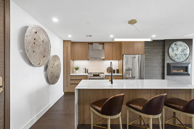 a kitchen with a dining table and chairs