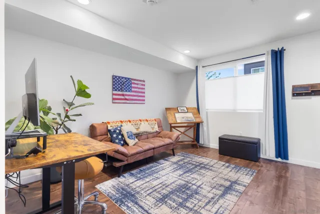 a living room with furniture and a rug