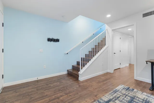 a view of entryway with wooden floor