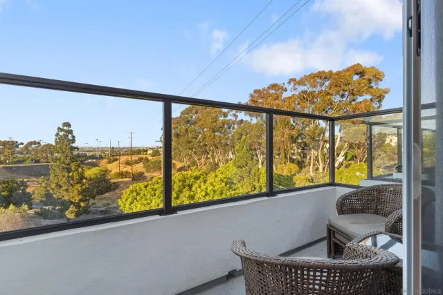 a view of balcony with furniture