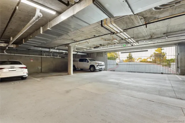 a view of parking garage with cars