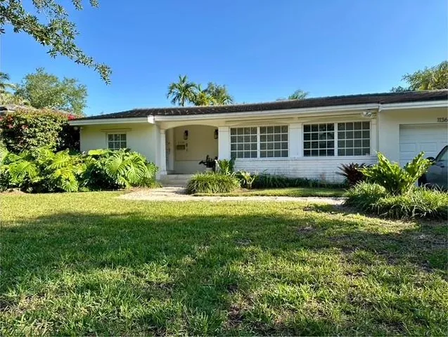 a house view with a garden space