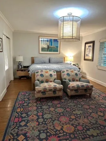 a bedroom with furniture and a window