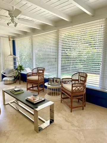 a view of a livingroom with furniture and a ceiling fan