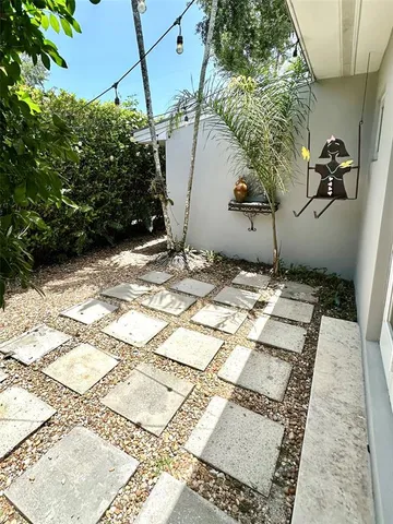 a view of a sitting area with furniture and garden