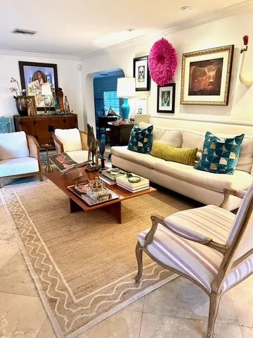a living room with furniture and a rug