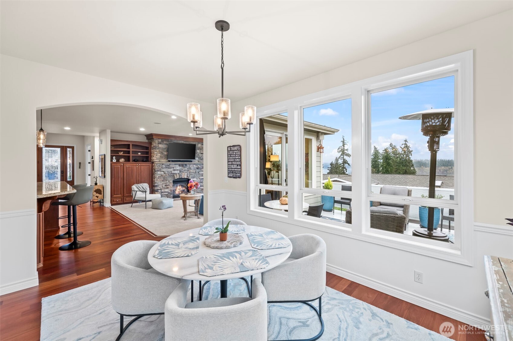 2702 60th Street Northwest Gig Harbor, WA 98335 - Photo 13 of 40 a view of a dining room with furniture window and wooden floor