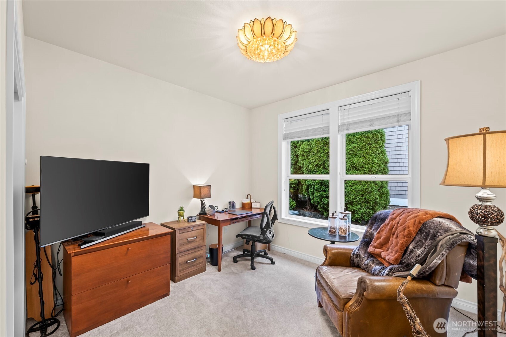 2702 60th Street Northwest Gig Harbor, WA 98335 - Photo 28 of 40 a living room with furniture and a flat screen tv