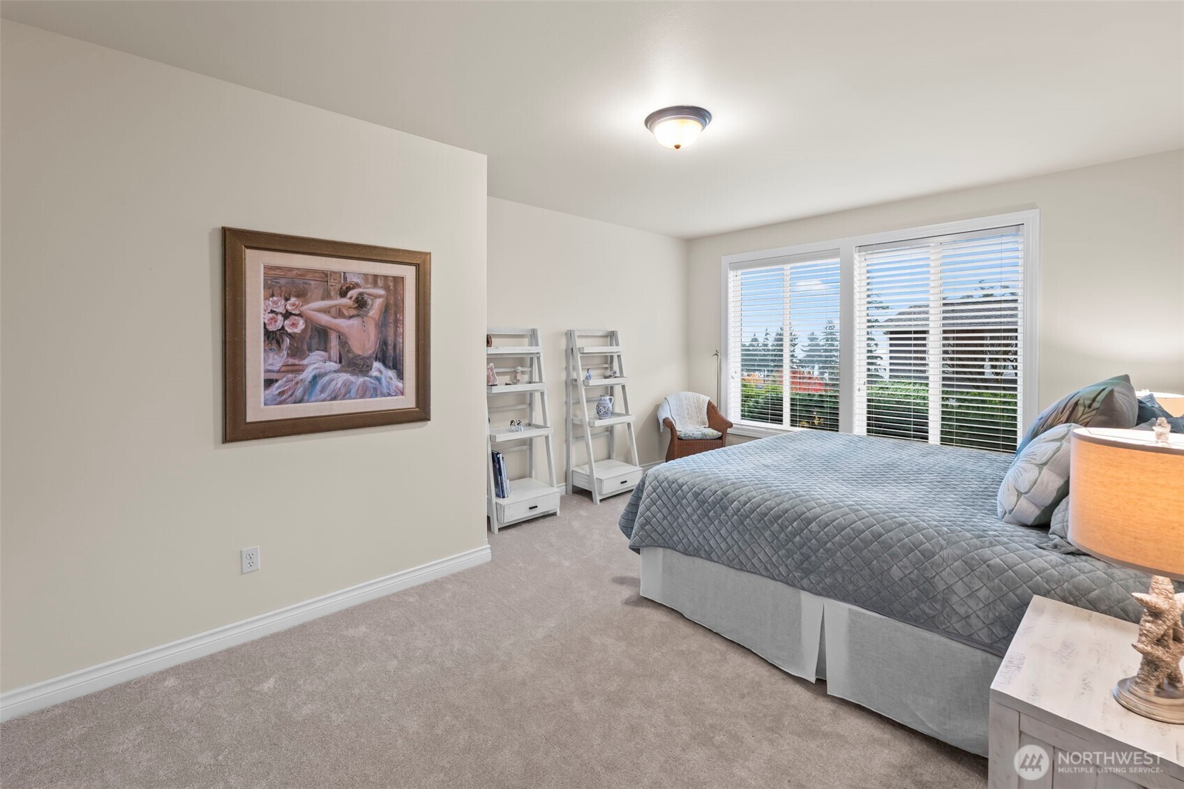 2702 60th Street Northwest Gig Harbor, WA 98335 - Photo 34 of 40 a spacious bedroom with a large bed and a large window