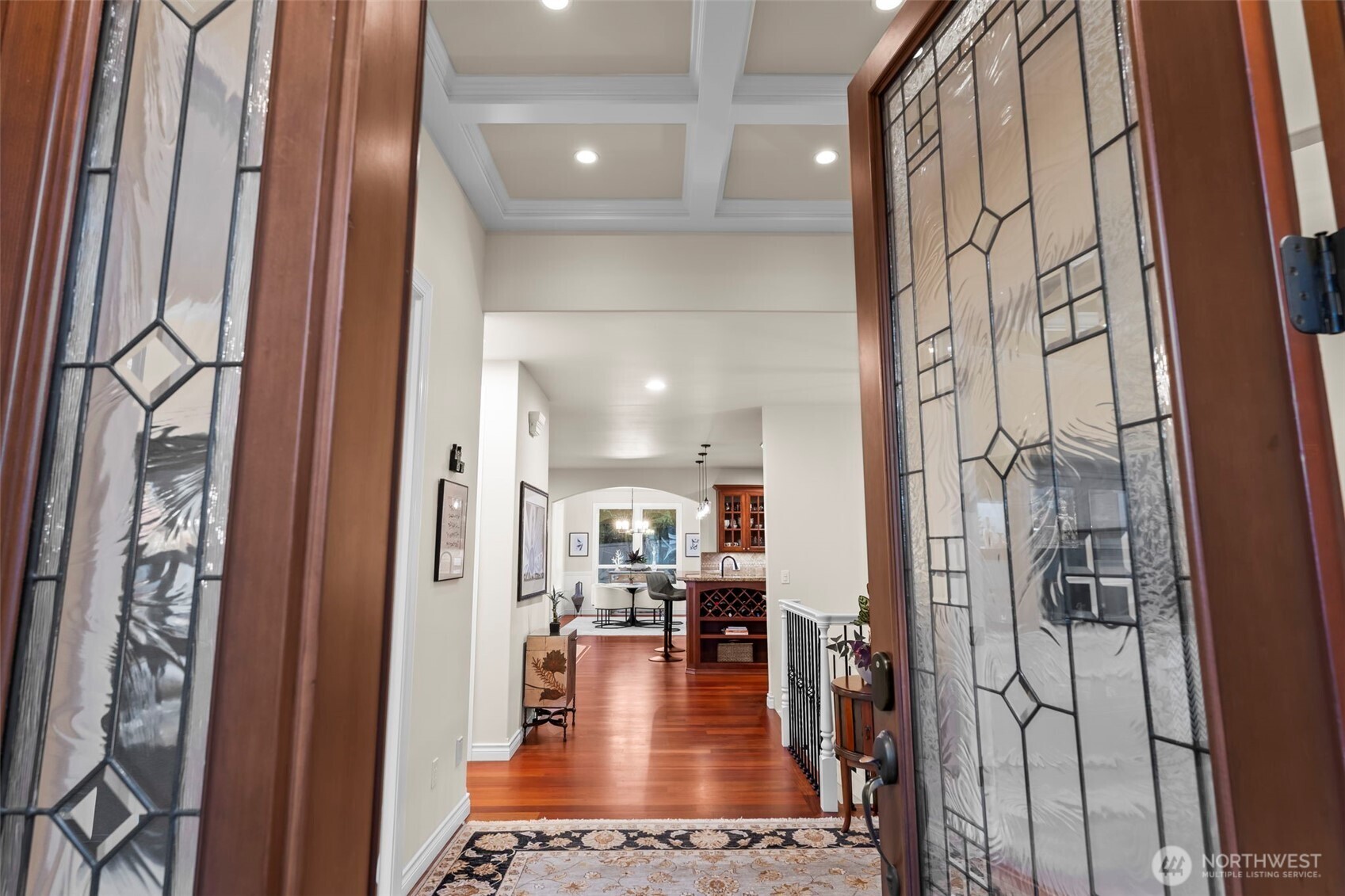 2702 60th Street Northwest Gig Harbor, WA 98335 - Photo 4 of 40 a view of a hallway with living room and dining room