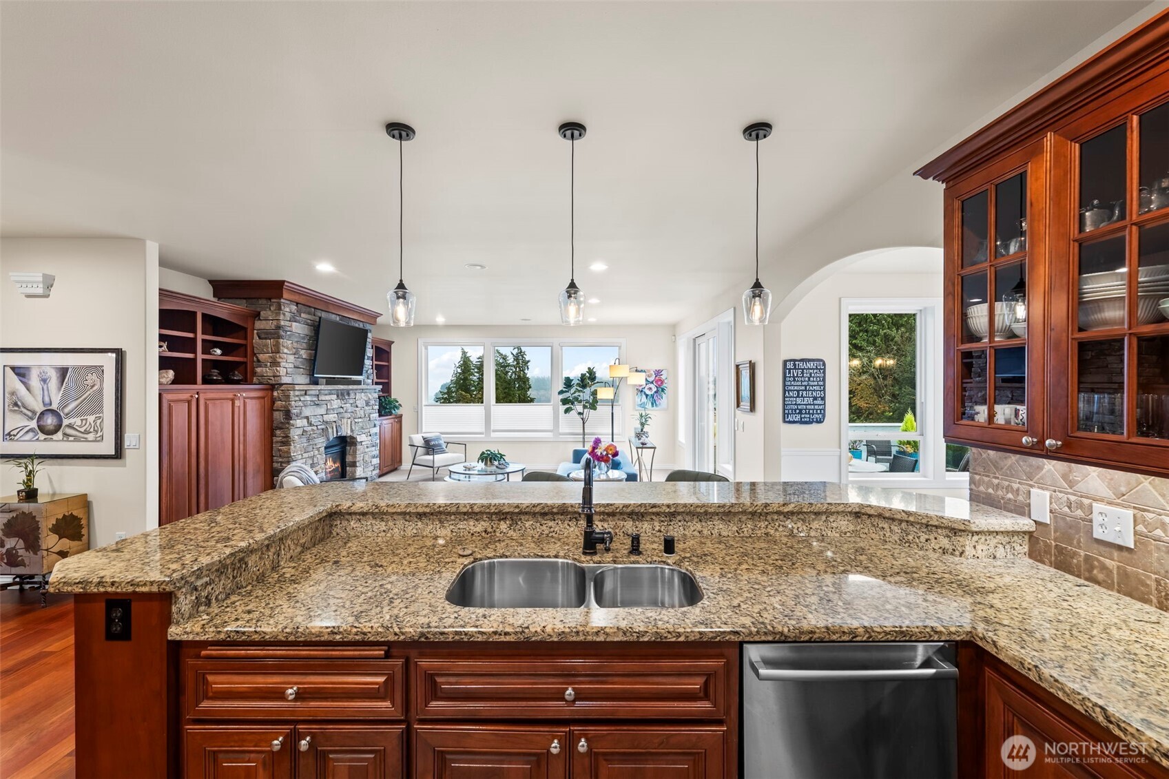 2702 60th Street Northwest Gig Harbor, WA 98335 - Photo 9 of 40 a kitchen with granite countertop a sink and a large window