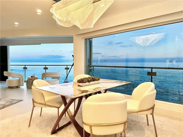 a living room with fireplace furniture and a large window