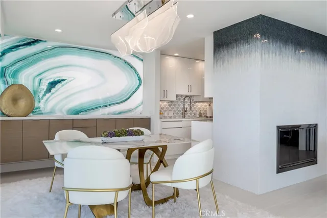 a kitchen with stainless steel appliances granite countertop a sink and a stove top oven with wooden floor