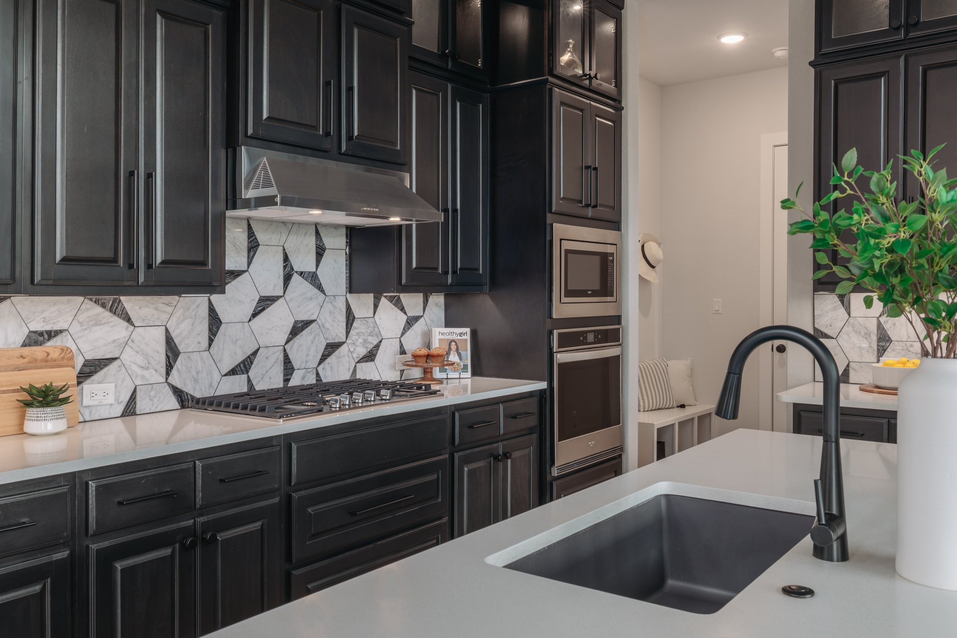 317 Autumn Oak Way Georgetown, TX 78628 - Photo 10 of 40 a kitchen with a refrigerator and a sink