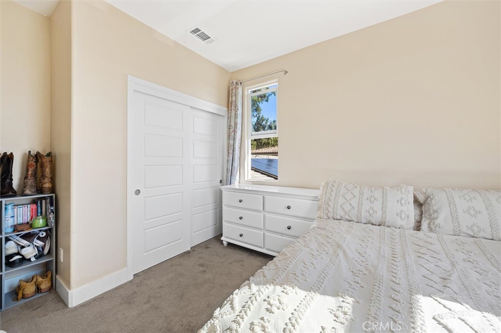 3898 Hayfield Loop San Luis Obispo, CA 93401 - Photo 16 of 19 a bedroom with a bed and a window