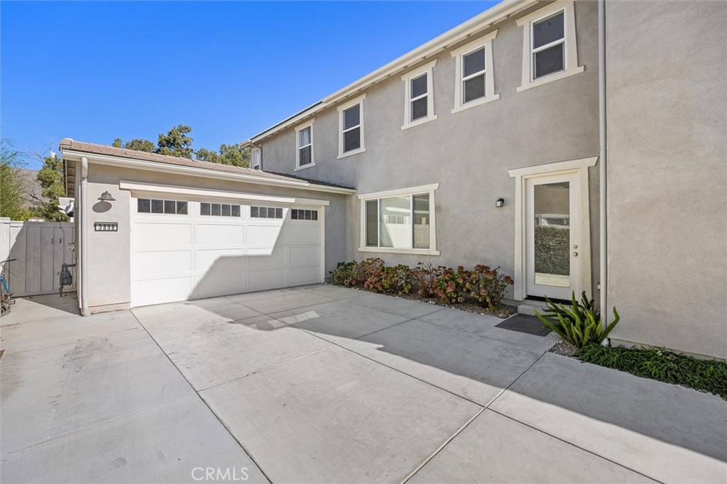 3898 Hayfield Loop San Luis Obispo, CA 93401 - Photo 18 of 19 a front view of a house with a yard and a garage