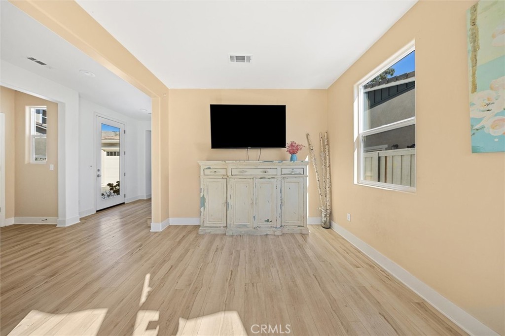 3898 Hayfield Loop San Luis Obispo, CA 93401 - Photo 7 of 19 a view of a livingroom with wooden floor and a flat screen tv