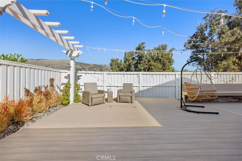 3898 Hayfield Loop San Luis Obispo, CA 93401 - Photo 10 of 19 a view of a patio with couches table and chairs and potted plants