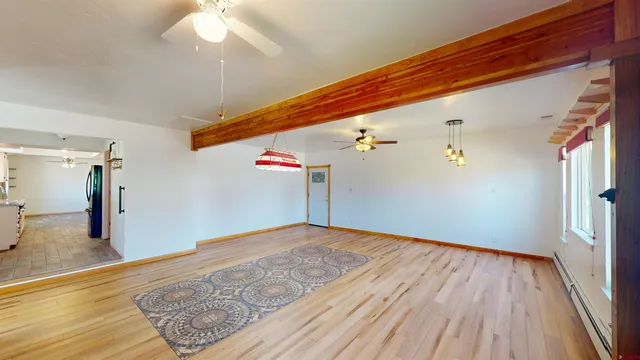 a view of a room with wooden floor