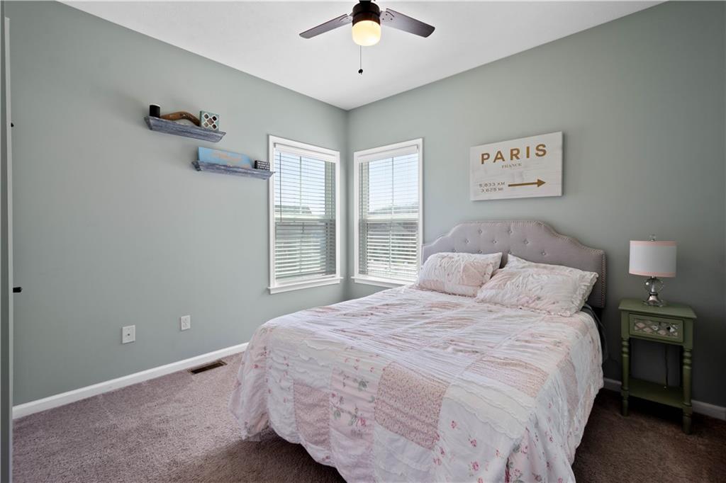 4528 Walnut Ridge Circle McDonald, PA 15057 - Photo 14 of 50 a bedroom with a bed and a chandelier