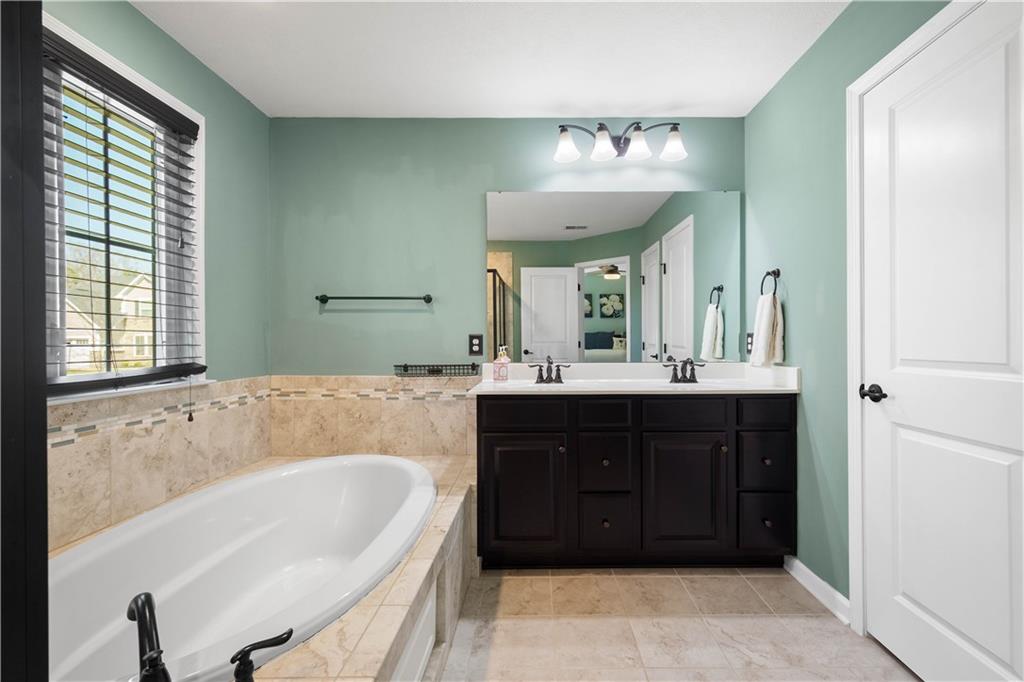 4528 Walnut Ridge Circle McDonald, PA 15057 - Photo 25 of 50 a spacious bathroom with a tub sink and mirror