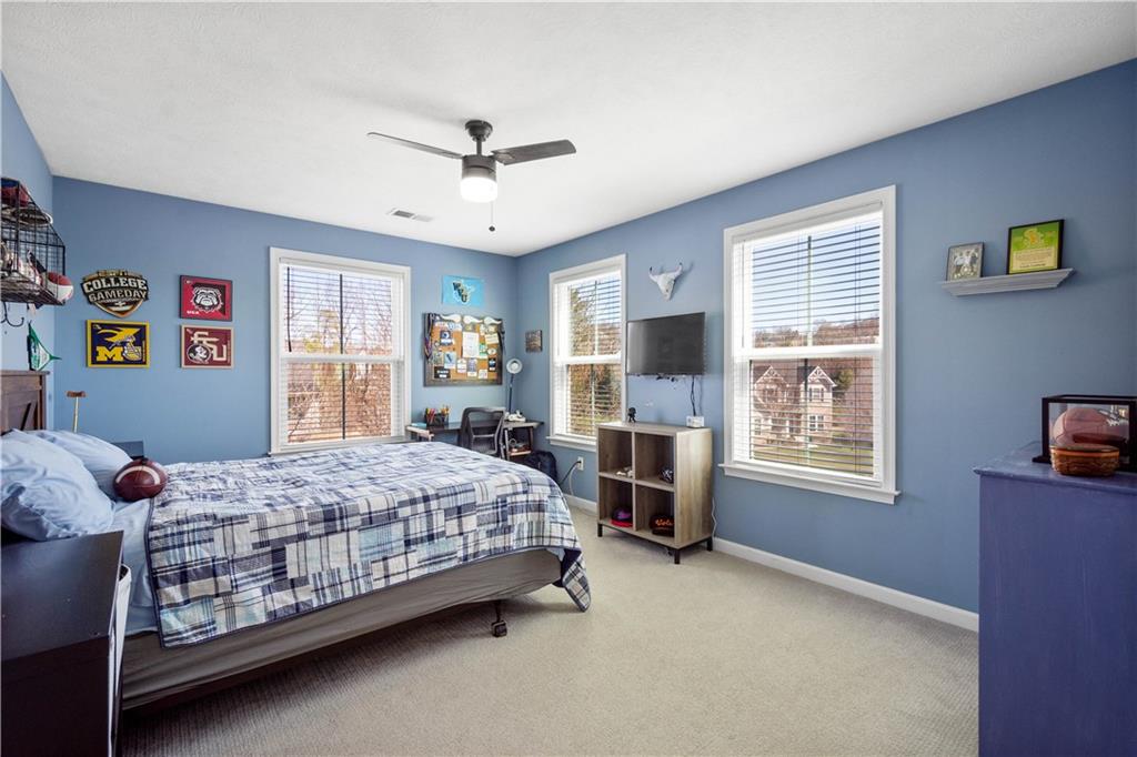 4528 Walnut Ridge Circle McDonald, PA 15057 - Photo 32 of 50 a bedroom with a bed couch and a window