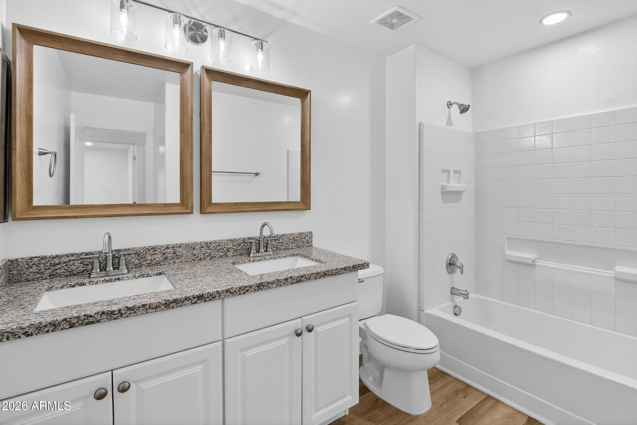43620 West Cowpath Road Maricopa, AZ 85138 - Photo 48 of 60 a bathroom with a granite countertop toilet sink and mirror