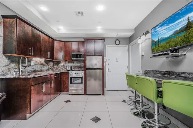 a living room with granite countertop furniture and a fireplace