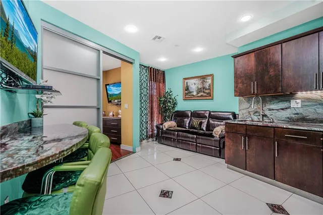 a bedroom with a bed and a television