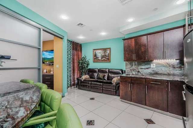 a kitchen with a table and chairs