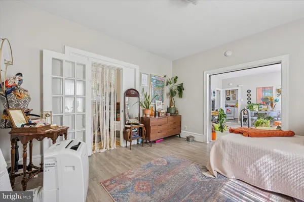 a bedroom with furniture and a window