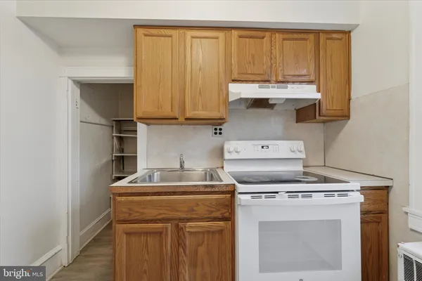 a kitchen with a sink and a window