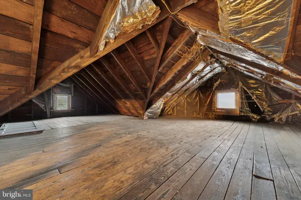 a view of a porch with wooden floor