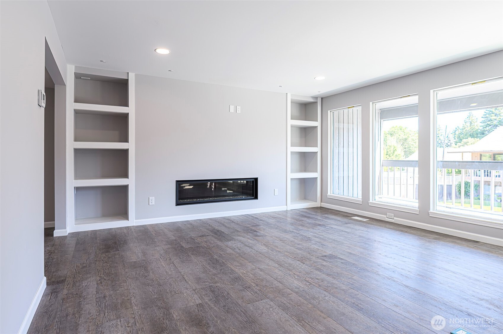 3 Burning Tree Drive, Unit 3 Yakima, WA 98902 - Photo 14 of 32 a view of an empty room with a window and wooden floor