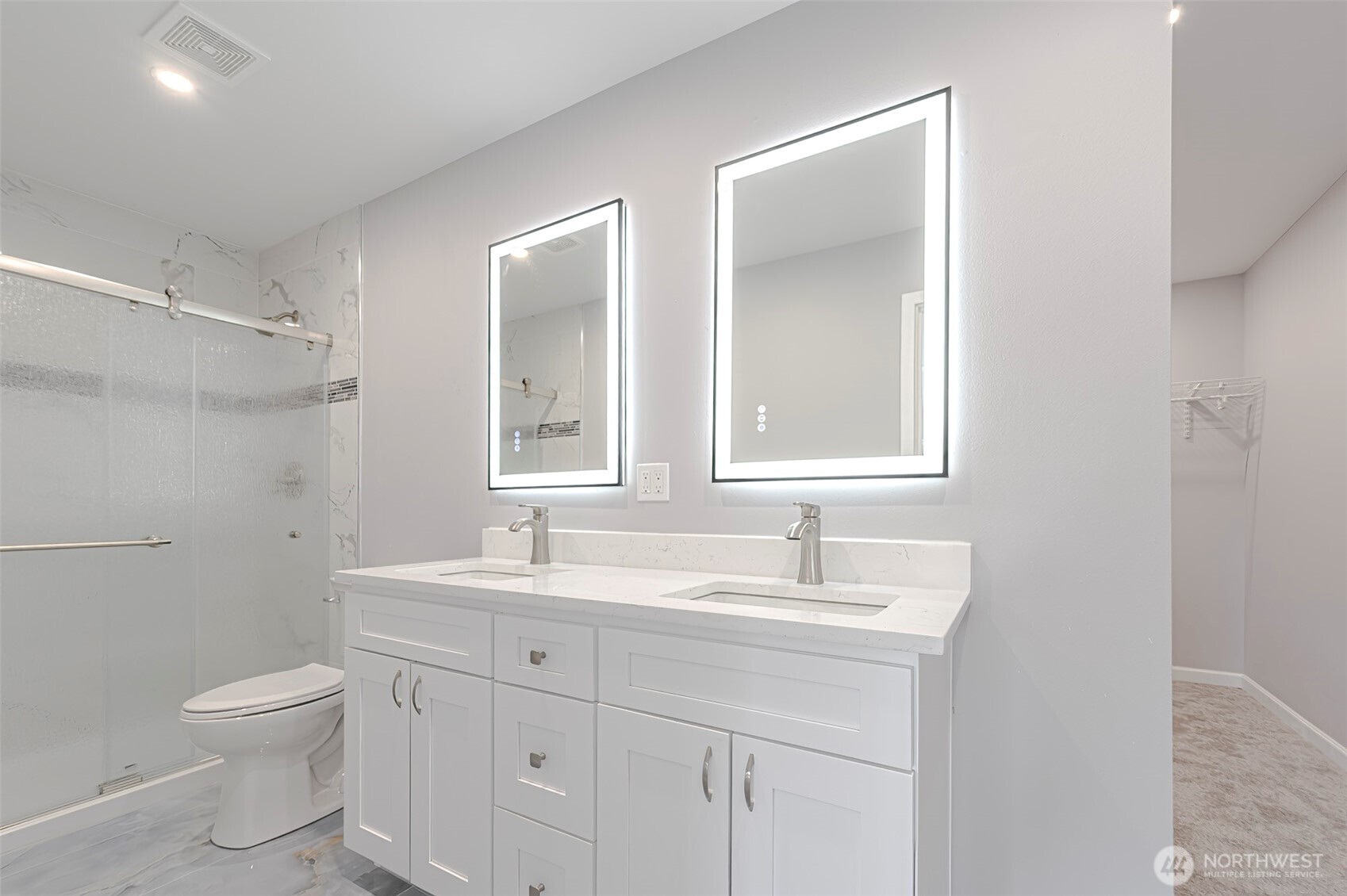 3 Burning Tree Drive, Unit 3 Yakima, WA 98902 - Photo 18 of 32 a bathroom with double vanity sink a mirror and a toilet