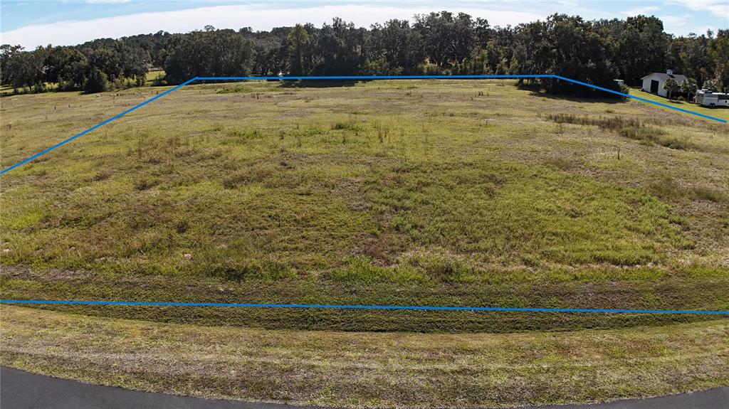 Northwest 54th Loop Ocala, FL 34482 - Photo 8 of 12 a view of an outdoor space and a yard