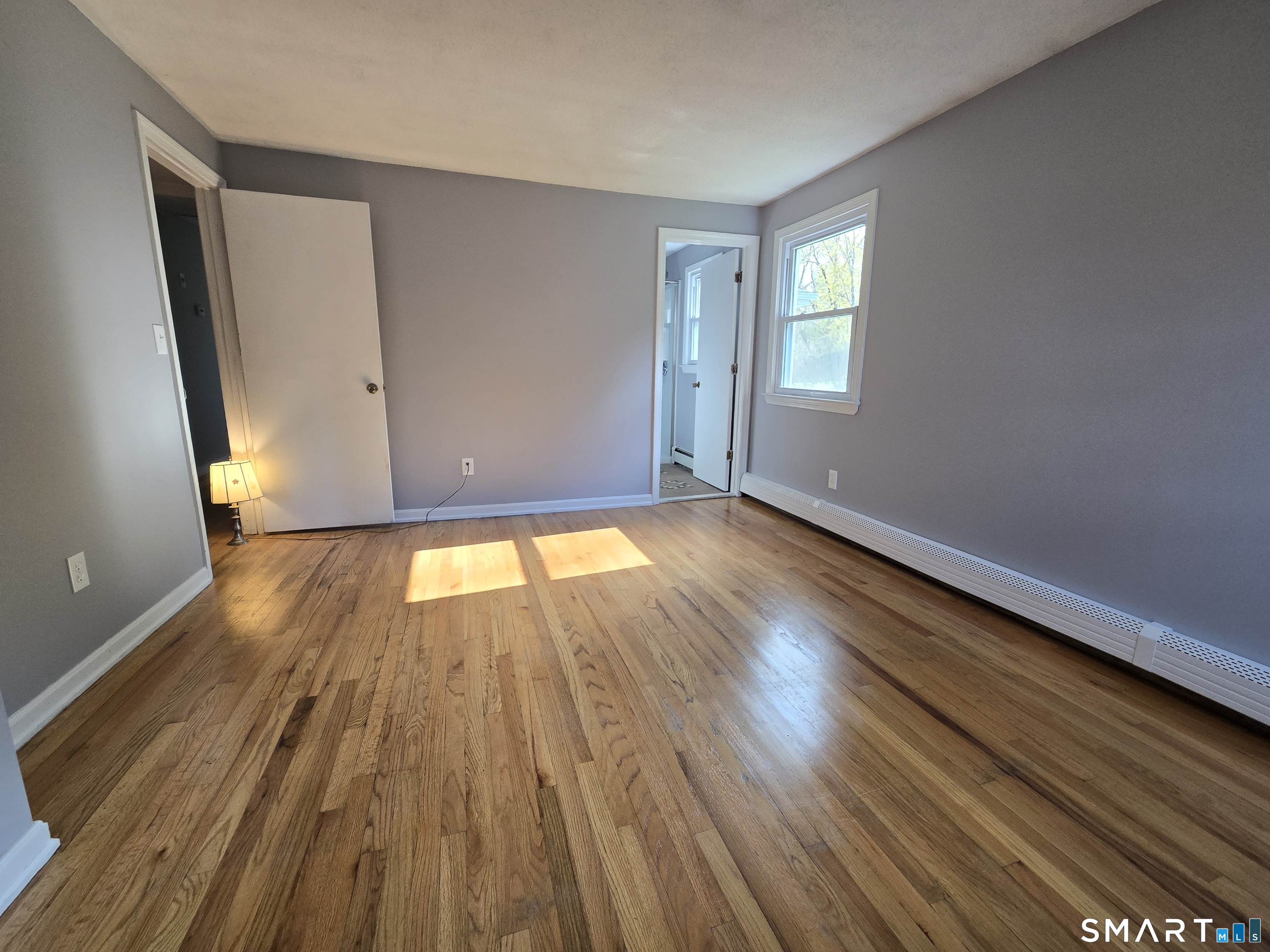 1004 Hickory Hill Road Thomaston, CT 06787 - Photo 20 of 23 a view of empty room with wooden floor and fan