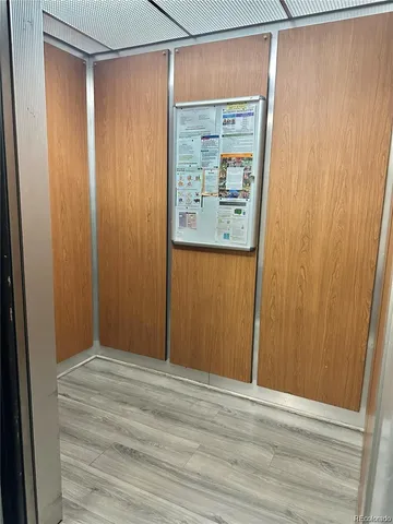 a view of an empty room with wooden door